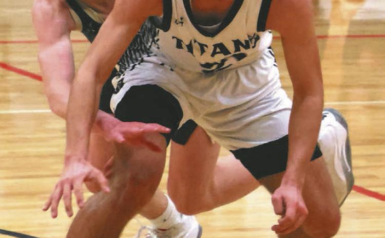 Trenten Keena fights off an attempted steal by a North Border defender.