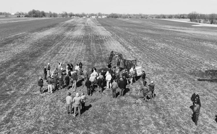 Farmers view a soil pit as part of an on-farm soil health research project. NDSU photo.