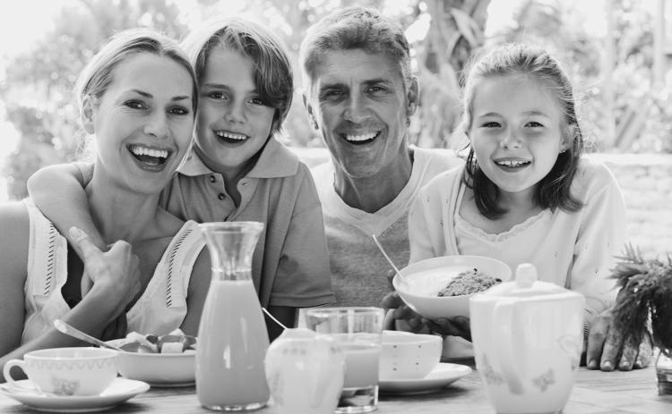 The benefits of eating together as a family apply whether the meals are at home or out and about.