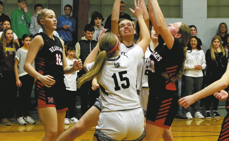 Titan Elizabeth Fedje battles to keep the ball following a rebound in Crystal on Feb. 7 against North Star. Photo by Jamie Rarick