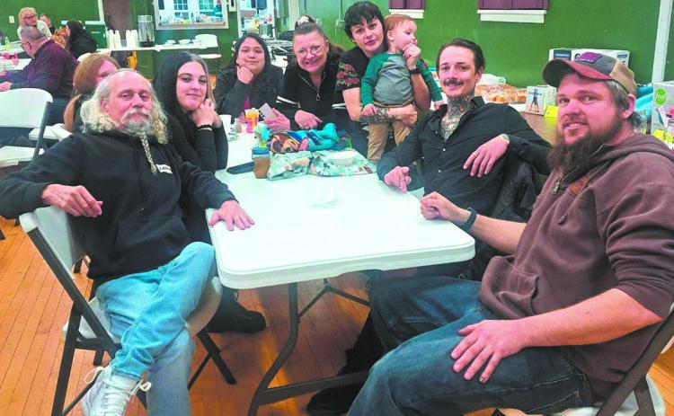 Chris Auen (far left) and his family at the fundraiser benefit last Saturday, Jan. 11. Photo by Christine Jensen