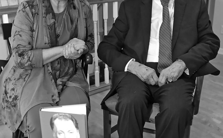 North Dakota’s longest serving Supreme Court Chief Justice Jerry VandeWalle poses with a copy of his biography, “Call Me Jerry” along with author Cecile Wehrman. Photo by Brad Nygaard, The Journal, Crosby.