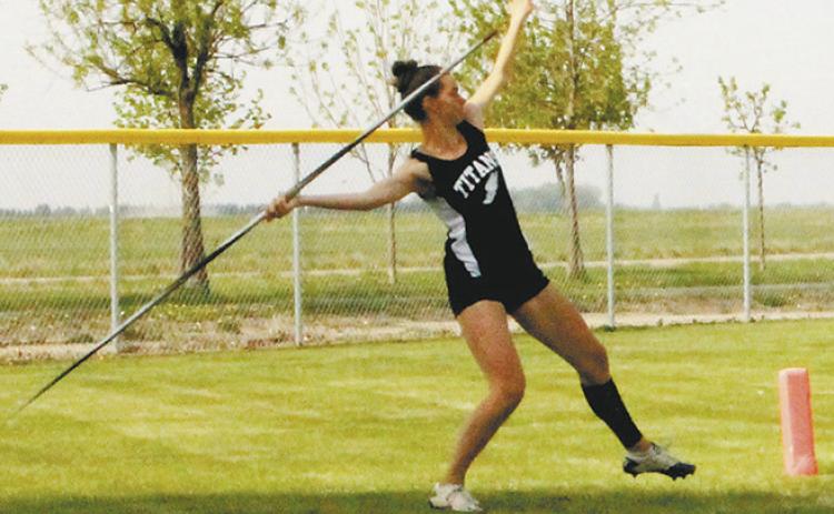 Elizabeth Fedje launches the javelin, winning the regional championship in the event with a distance of 115' 6' at the North East Region Meet. Photo by Jamie Rarick