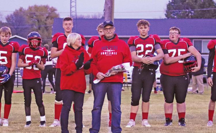 Pictured above: Coach Jeryl “Murph” Thompson stands in front of his Varsity football team with his wife Patti at his side while being honored for 40 years of coaching. VNV Photo by Lesa Van Camp