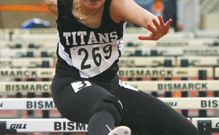 Jocelyn Vold competes in the 100-meter hurdle preliminaries at the Class B State Track Meet. Photo by Larry Stokke