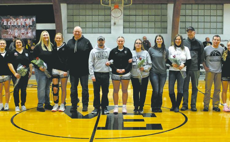 Together with their parents, seniors Greta Burrell, Easton Larson, Aleah Pokrzywinski, Hannah Myrdal, and Reese Fering were recognized on Senior Night before the game in Crystal Jan. 24. Photo by Jamie Rarick