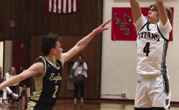 Charles Kittelson shoots over North Border’s Kaden Moore.