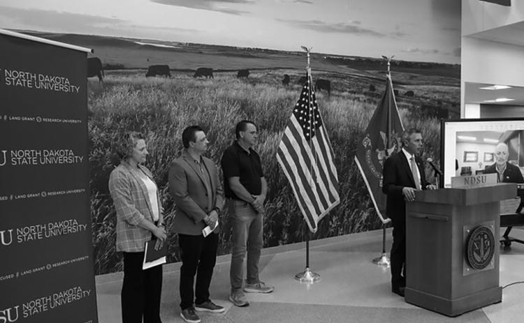 Gov. Armstrong announces the Grain Storage &amp; Facility Rebuilder Program at NDSU. Armstrong was joined by (L-R) Miranda Meehan, NDSU Extension disaster coordinator, James Burgum, CEO at The Arthur Companies, and Steve Johnson, farmer from Page, ND.