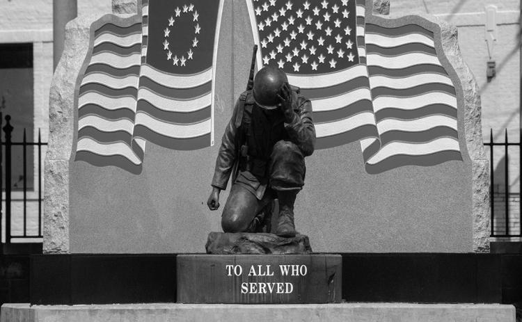 Memorial Statue located at Fort Smith, AZ National Cemetery. Located on a beautiful lawn and garden area, the cemetery is the home of thousands of gravestones of brave fallen soldiers, known and unknown.