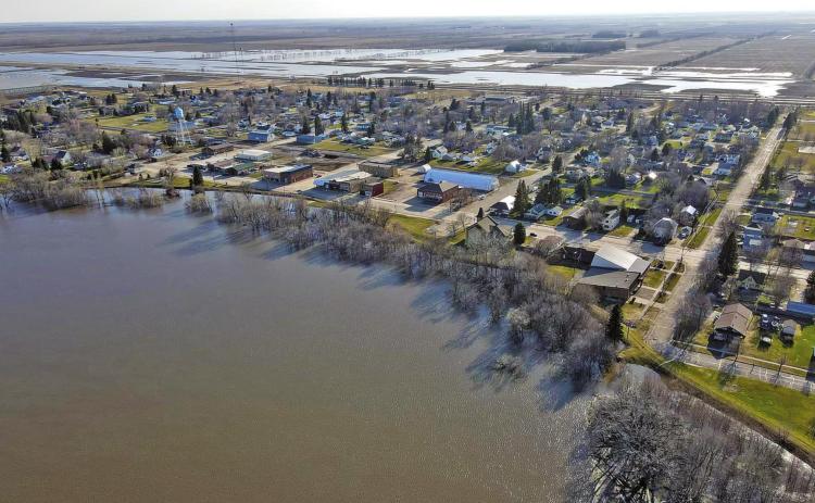 Drone flood picture taken by Travis Uggerud last Wednesday while patrolling the dikes in Drayton shows the town looking slightly like an island just before the river reached its crest last week.