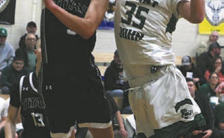 Jayse Gullickson shoots past St.John's Simon LaRocque.