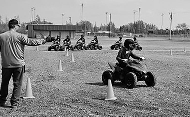A child participates in a North Dakota OHV Youth Safety Course certification training program held during an NDSU Extension Farm Safety Camp. NDSU photo