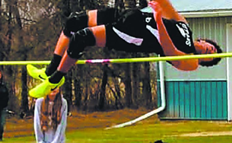 Mason Pollestad clears the high jump at the HCV meet, setting a new personal record at 5' 8'. Photo by Jamie Rarick