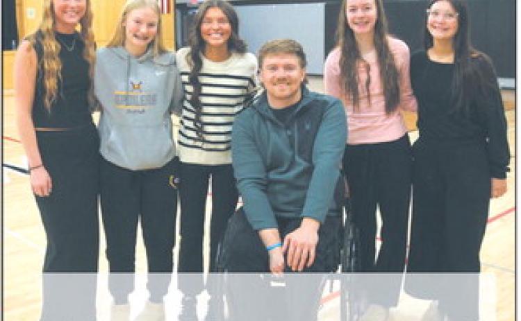 Peyton Larson, Nulla Thompson, Mikala Mccoy, Jocelyn Vold, and Maia Hermanson shared a moment with Hunter Pinke following Thursday's visit. There was a good-natured rivalry before the evening's game against Hatton Northwood, where Pinke’s sisters play basketball. Photo by Jamie Rarick