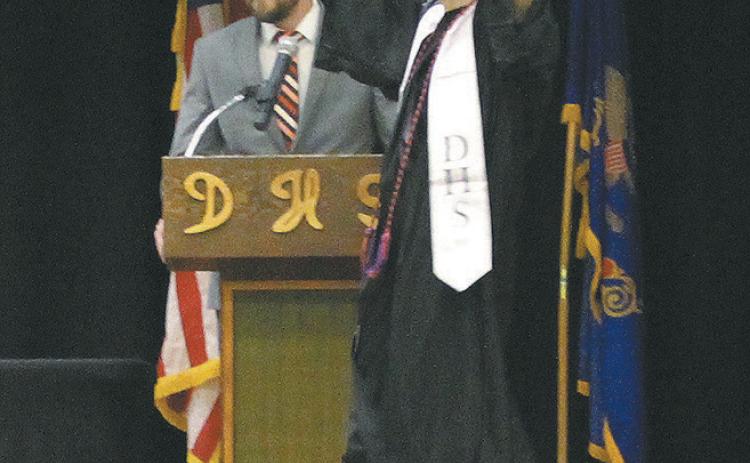 Senior Trypp Castillo doing a happy dance on his way to receive his diploma. Photo by Andrea Johnston