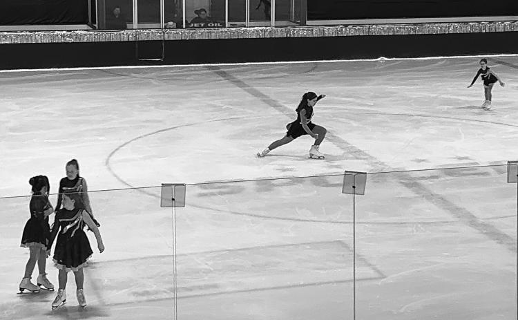Amelia glides across the ice during the Basic 5 portion of the Grafton Figure Skating Show, “Go for Gold.” Photo by Rebecca Davis