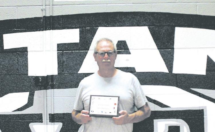 Drayton Coach Murph Thompson was recognized at Friday's volleyball game and presented with a plaque for 45 years of coaching service by the North Dakota High School Coaches Association. Photo by Jamie Rarick.