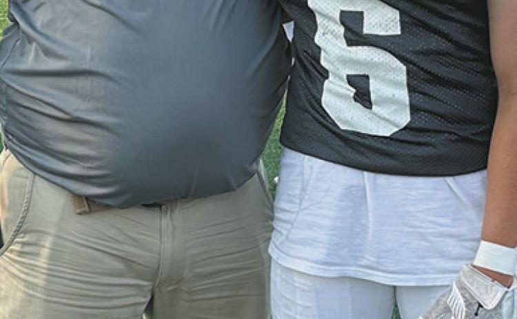 North Border head coach Tim Hartje and Eagles player Grant Cosley were both invited to the 51st North Dakota Shrine Bowl, held in Mayville on June 21. Photo by Larry Stokke.