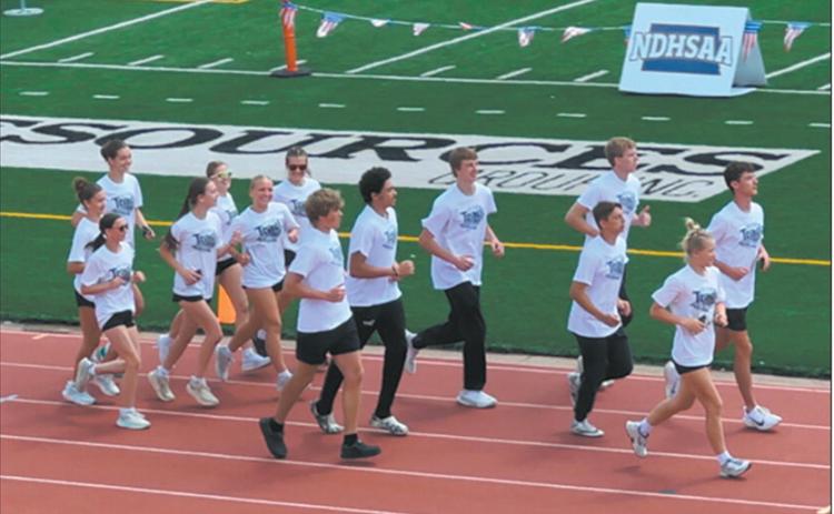 DVE Titans Parade of Athletes 2025 State Track and Field Meet from infield to track lanes, left to right: Elizabeth Fedje, Rosalyn Fedje, Milla Fagerholt; Greta Burrell, Jocelyn Vold; Violet Hoyles, Reese Fering; Jack Langerud, Mason Pollestad, Sam Kittelson; Carter Oberg, Carter Johnson; Brady Reilly, Alyssa Hoyles. Submitted photo