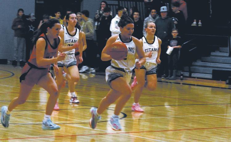 DVE junior Brooke Gullickson strips the ball and breaks away from the pack. Photo by Jamie Rarick
