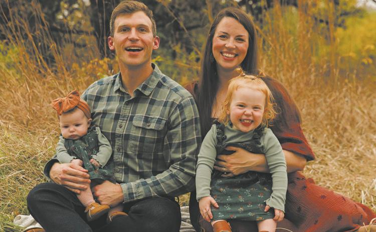 Levi and Rachel Bachmeier with daughters Roslin (left) and Linden (right).