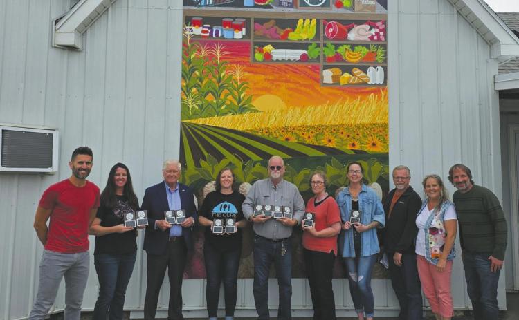 This years Best of the Rendezvous winners in front of the Rendezvous Region sponsored mural in Hoople. Photo courtesy of Rendezvous Region Tourism Council.