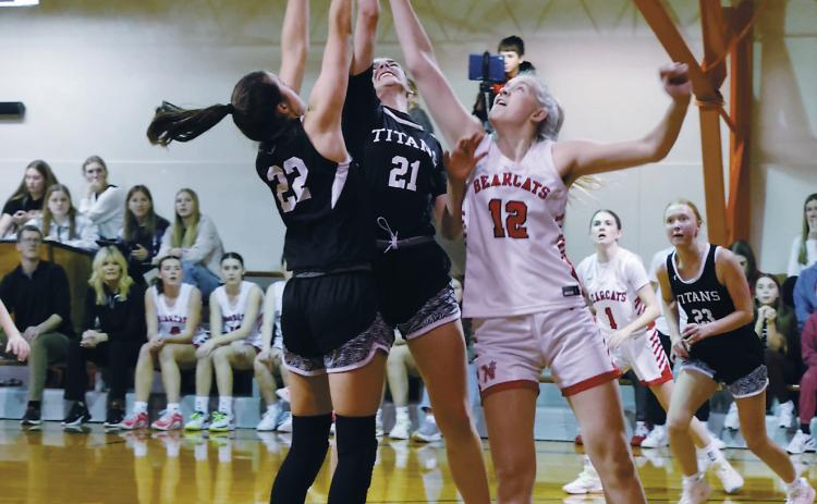DVE's Jaelyn Johnson and Elizabeth Fedje fight North Star's Annabelle Staus for the rebound. Photo by Jamie Rarick