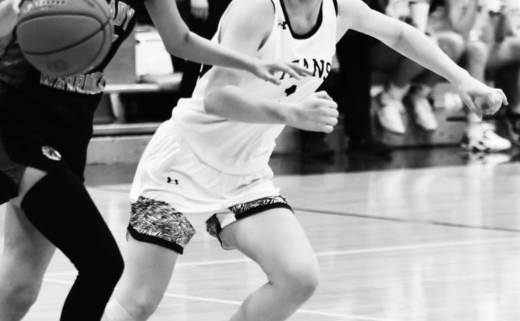 Alyssa Hoyles plays strong defense against the Lady Warriors. Photo by Lyle Van Camp.