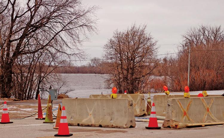 The Red River is rising out of the banks a little more each day looking more like a lake than a river with each passing day as seen in this view looking Southeast from Main Street. VNV Photo by Lesa Van Camp
