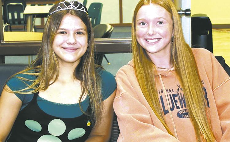 Representing the sophomore class, Violet Hoyles and Peyton Larson volunteered at the check-in table for Wednesday's blood drive at the school. Photo by Jamie Rarick.