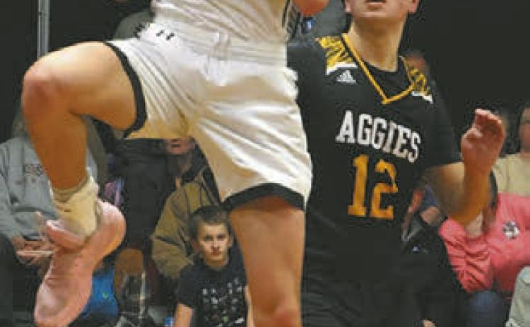 Everett Fedje pulls down a rebound against Park River last Tuesday.