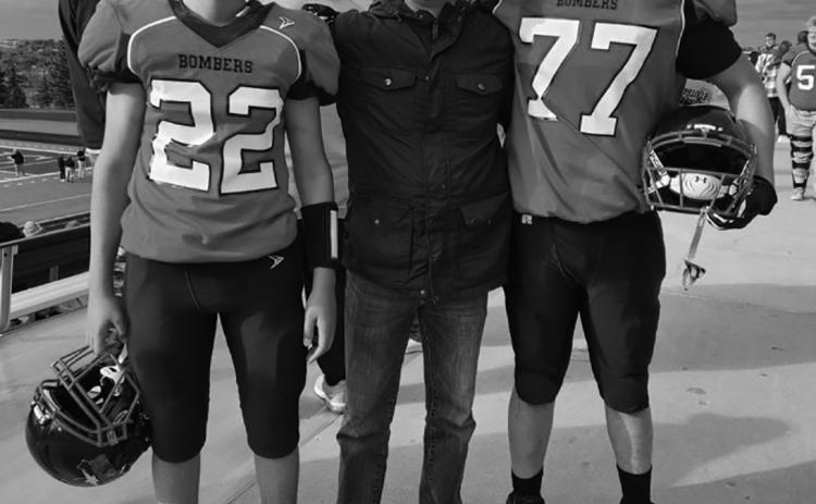 Tanio DeSouza accompanied by #22, his nephew Lucus DeSouza, and #77, his son Daniel DeSouza. Picture by Tanio’s daughter, Melissa, in Minot at the playoffs.