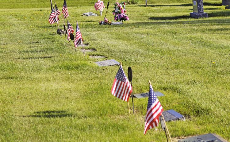 Flags decorating the gravesites of Veterans buried in the Drayton Cemetery for Memorial Day. VNV Photo by Lesa Van Camp