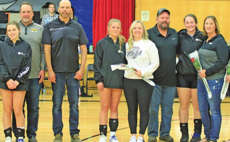 Pictured above left to right: Senior Titan volleyball players and their parents who where honored Saturday afternoon in the Drayton gym. Kim Hannesson, Kendra Hannesson, Troy Hannessson, Jeanette Gimmell, Chloe Gimmell, Ron Gimmell, Lisa Oberg, Hannah Oberg, Steve Oberg, Jamie Oberg, Katelyn Oberg, Mandy Oberg, Mark Hermanson, Maddison Hermanson, Jessica Hermanson, Sondra Verke, Aliyah Bartels, Ryan Bartels, Kerri Stegman, Kasey Stegman, and Wayne Stegman. VNV Photo by Lesa Van Camp