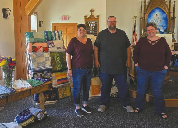 and fabric previously owned by their late mother. Photo by Christine Jensen. Tami VanCamp, Greg Osowski, and Trish Trousil generously donated sewing machines